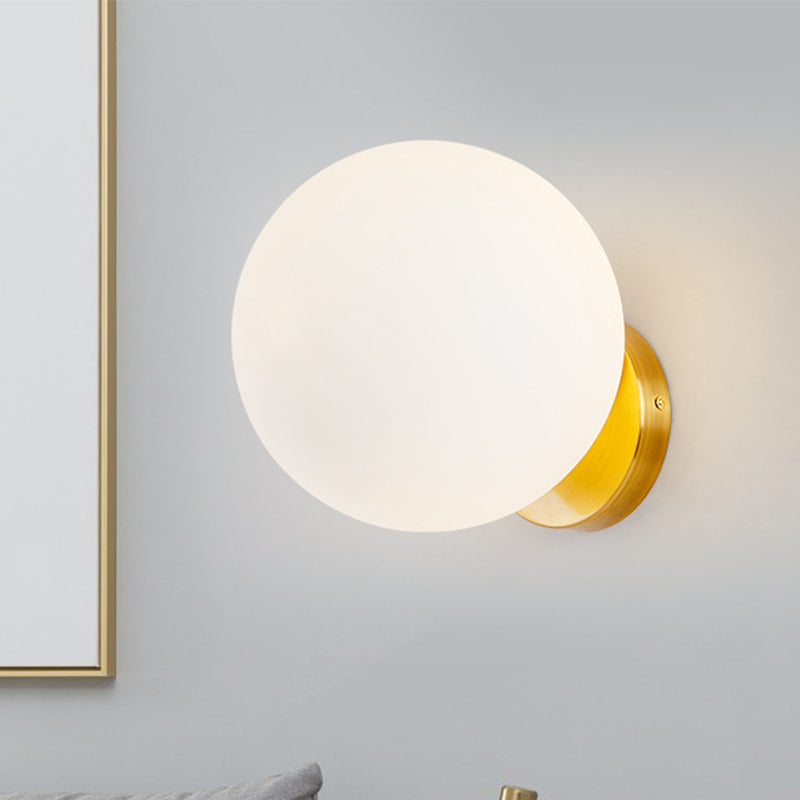 Minimalist 1 Bulb Bedside Sconce Light Matte White Glass Ball Wall Mount Lamp in Gold Clearhalo 'Cast Iron' 'Glass' 'Industrial' 'Modern wall lights' 'Modern' 'Tiffany' 'Traditional wall lights' 'Wall Lamps & Sconces' 'Wall Lights' Lighting' 269618