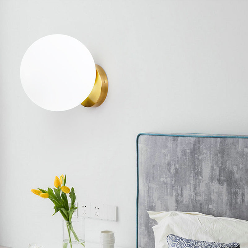 Minimalist 1 Bulb Bedside Sconce Light Matte White Glass Ball Wall Mount Lamp in Gold Clearhalo 'Cast Iron' 'Glass' 'Industrial' 'Modern wall lights' 'Modern' 'Tiffany' 'Traditional wall lights' 'Wall Lamps & Sconces' 'Wall Lights' Lighting' 269619