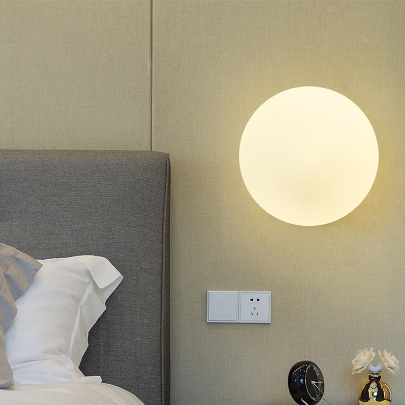 Minimalist 1 Bulb Bedside Sconce Light Matte White Glass Ball Wall Mount Lamp in Gold Clearhalo 'Cast Iron' 'Glass' 'Industrial' 'Modern wall lights' 'Modern' 'Tiffany' 'Traditional wall lights' 'Wall Lamps & Sconces' 'Wall Lights' Lighting' 269620