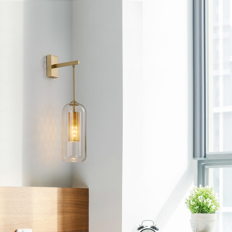Golden Cylinder Wall Mount Lamp Simple 1 Bulb Clear Glass Sconce Light Fixture for Bedroom Clearhalo 'Cast Iron' 'Glass' 'Industrial' 'Modern wall lights' 'Modern' 'Tiffany' 'Traditional wall lights' 'Wall Lamps & Sconces' 'Wall Lights' Lighting' 273189