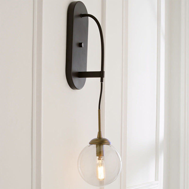 Drop Wall Sconce Minimalist Clear Glass 1 Light Black Wall Mounted Light Fixture Clearhalo 'Cast Iron' 'Glass' 'Industrial' 'Modern wall lights' 'Modern' 'Tiffany' 'Traditional wall lights' 'Wall Lamps & Sconces' 'Wall Lights' Lighting' 273257