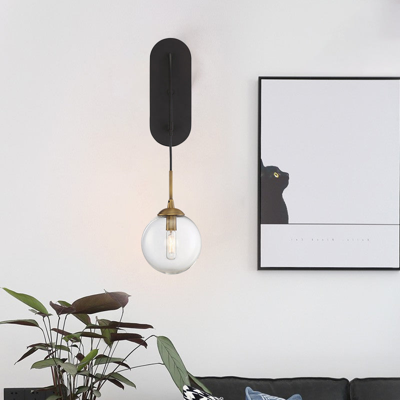 Drop Wall Sconce Minimalist Clear Glass 1 Light Black Wall Mounted Light Fixture Clearhalo 'Cast Iron' 'Glass' 'Industrial' 'Modern wall lights' 'Modern' 'Tiffany' 'Traditional wall lights' 'Wall Lamps & Sconces' 'Wall Lights' Lighting' 273259