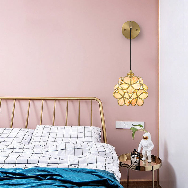 Modernist 1 Bulb Bedside Sconce Light Brass Floral Ball Wall Mount Lamp with Pink/Clear/Light Pink Glass Shade Clearhalo 'Cast Iron' 'Glass' 'Industrial' 'Modern wall lights' 'Modern' 'Tiffany' 'Traditional wall lights' 'Wall Lamps & Sconces' 'Wall Lights' Lighting' 273304