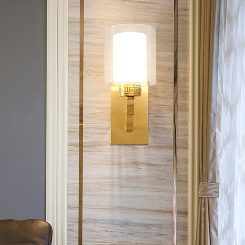 1 Head Wall Lighting with Cylinder Shade Clear and White Glass Modern Style Bedroom Wall Sconce in Brass Brass Clearhalo 'Wall Lamps & Sconces' 'Wall Lights' Lighting' 273839