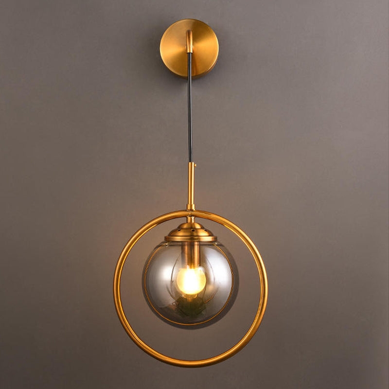 Orbit Smoke Gray/Clear/Amber Glass Wall Lamp Contemporary Single Brass Finish Sconce Light Fixture Smoke Gray Clearhalo 'Cast Iron' 'Glass' 'Industrial' 'Modern wall lights' 'Modern' 'Tiffany' 'Traditional wall lights' 'Wall Lamps & Sconces' 'Wall Lights' Lighting' 274473