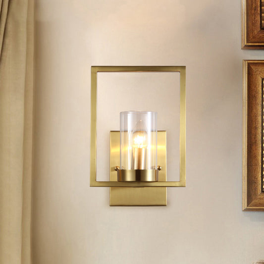 Cylindrical Bedroom Wall Sconce Clear Glass 1 Bulb Contemporary Wall Light Fixture in Brass with Frame Clearhalo 'Cast Iron' 'Glass' 'Industrial' 'Modern wall lights' 'Modern' 'Tiffany' 'Traditional wall lights' 'Wall Lamps & Sconces' 'Wall Lights' Lighting' 274584