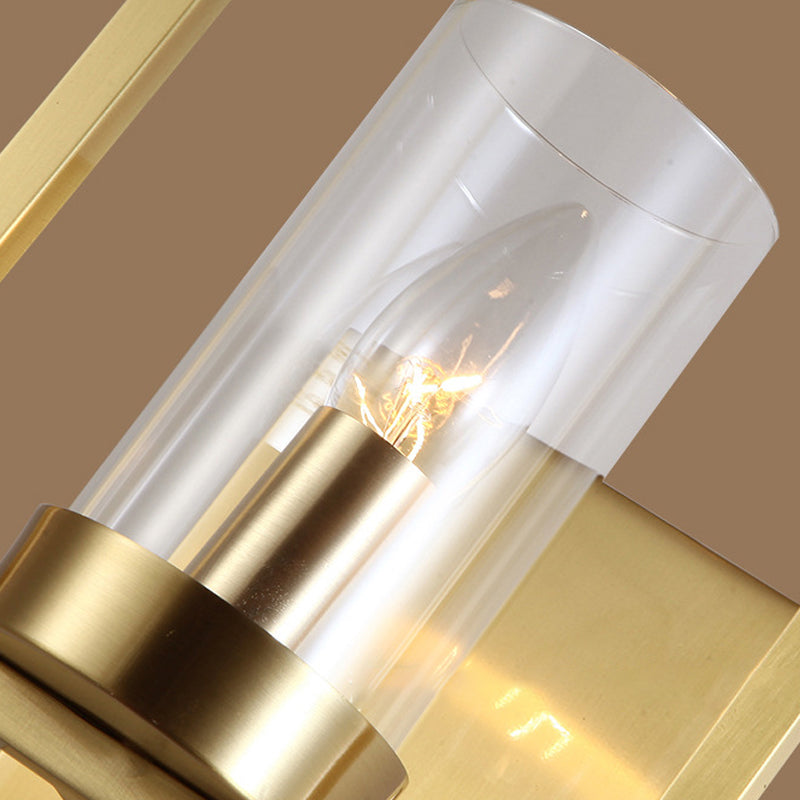 Cylindrical Bedroom Wall Sconce Clear Glass 1 Bulb Contemporary Wall Light Fixture in Brass with Frame Clearhalo 'Cast Iron' 'Glass' 'Industrial' 'Modern wall lights' 'Modern' 'Tiffany' 'Traditional wall lights' 'Wall Lamps & Sconces' 'Wall Lights' Lighting' 274590