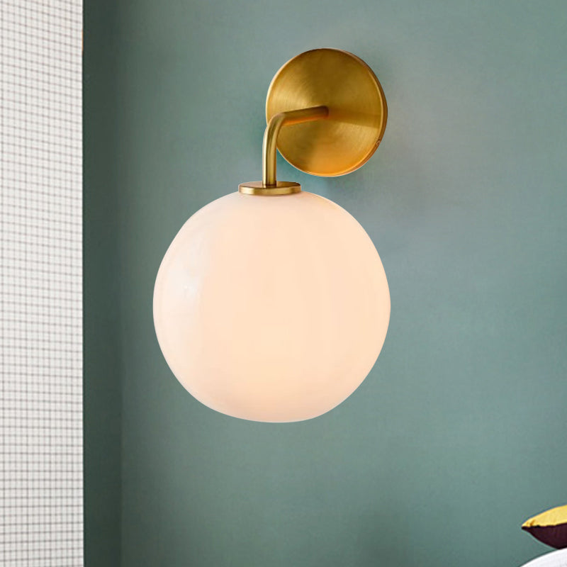 Clear/White Glass Orb Sconce Light Post Modern Single Light Wall Sconce with Brass Arm White Clearhalo 'Cast Iron' 'Glass' 'Industrial' 'Modern wall lights' 'Modern' 'Tiffany' 'Traditional wall lights' 'Wall Lamps & Sconces' 'Wall Lights' Lighting' 275695