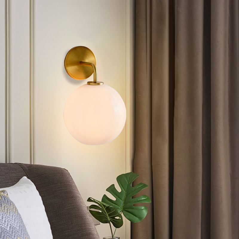 Clear/White Glass Orb Sconce Light Post Modern Single Light Wall Sconce with Brass Arm Clearhalo 'Cast Iron' 'Glass' 'Industrial' 'Modern wall lights' 'Modern' 'Tiffany' 'Traditional wall lights' 'Wall Lamps & Sconces' 'Wall Lights' Lighting' 275697