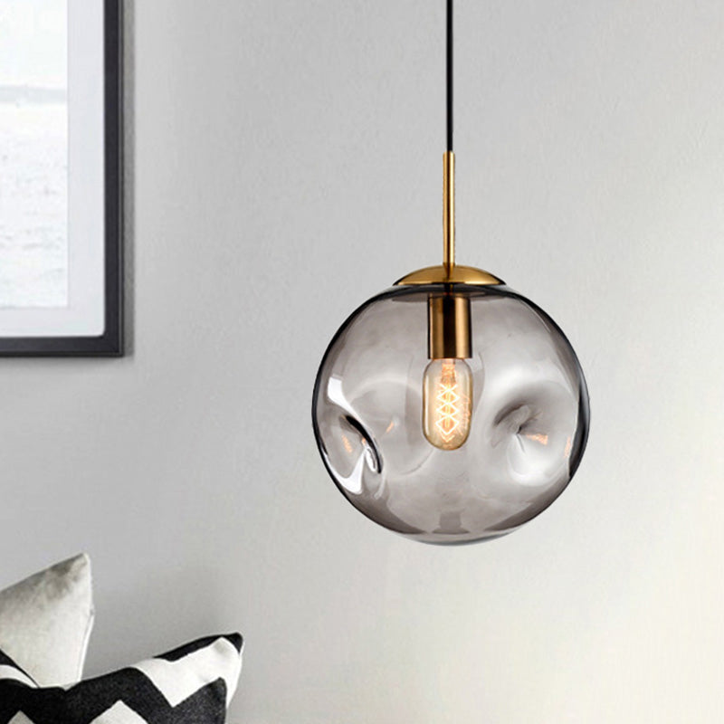 Globe Pendant Light Nordic Amber/Smoke Gray Dimpled Glass 1 Head Dining Room Hanging Ceiling Light Smoke Gray Clearhalo 'Ceiling Lights' 'Modern Pendants' 'Modern' 'Pendant Lights' 'Pendants' Lighting' 289051