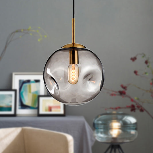 Globe Pendant Light Nordic Amber/Smoke Gray Dimpled Glass 1 Head Dining Room Hanging Ceiling Light Clearhalo 'Ceiling Lights' 'Modern Pendants' 'Modern' 'Pendant Lights' 'Pendants' Lighting' 289053