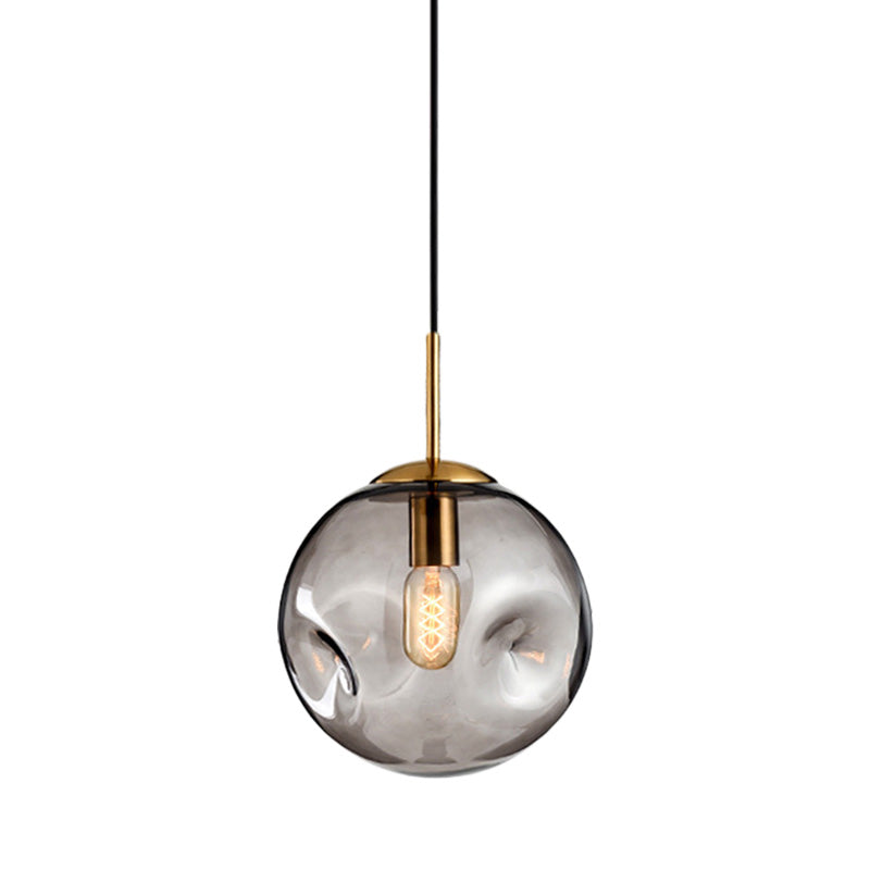 Globe Pendant Light Nordic Amber/Smoke Gray Dimpled Glass 1 Head Dining Room Hanging Ceiling Light Clearhalo 'Ceiling Lights' 'Modern Pendants' 'Modern' 'Pendant Lights' 'Pendants' Lighting' 289055