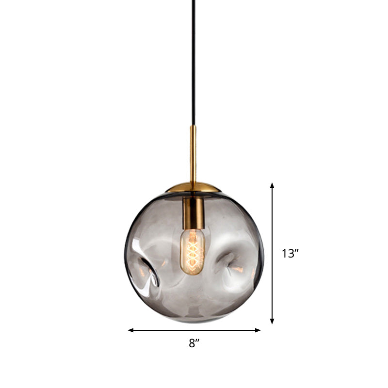 Globe Pendant Light Nordic Amber/Smoke Gray Dimpled Glass 1 Head Dining Room Hanging Ceiling Light Clearhalo 'Ceiling Lights' 'Modern Pendants' 'Modern' 'Pendant Lights' 'Pendants' Lighting' 289056