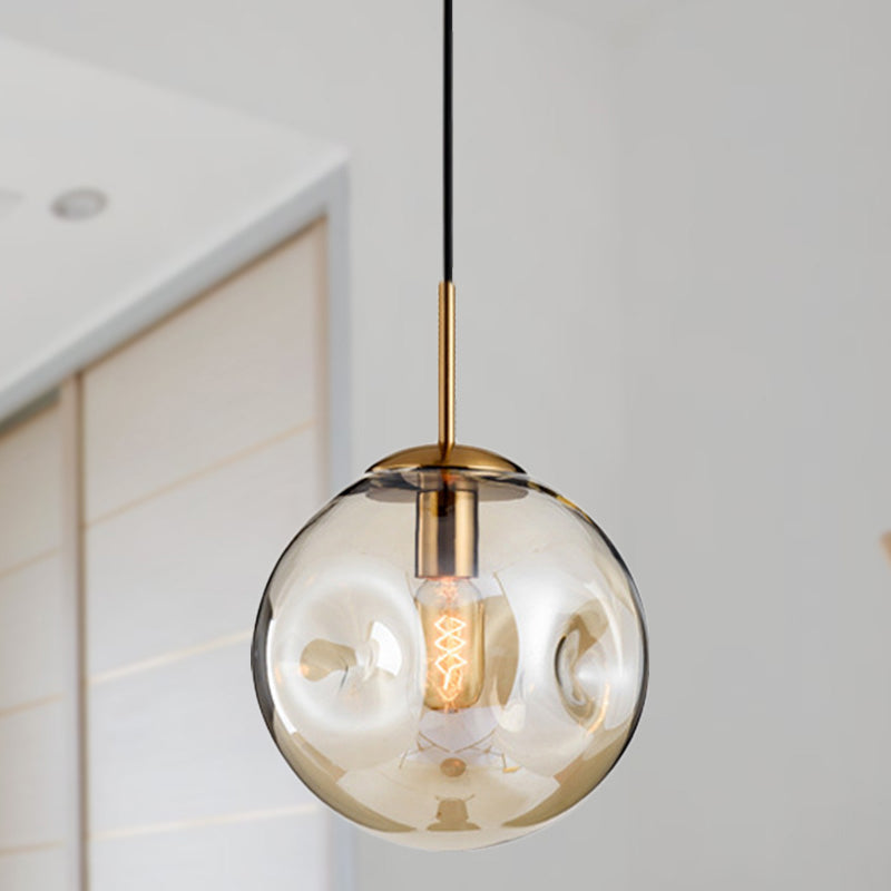 Globe Pendant Light Nordic Amber/Smoke Gray Dimpled Glass 1 Head Dining Room Hanging Ceiling Light Amber Clearhalo 'Ceiling Lights' 'Modern Pendants' 'Modern' 'Pendant Lights' 'Pendants' Lighting' 289057