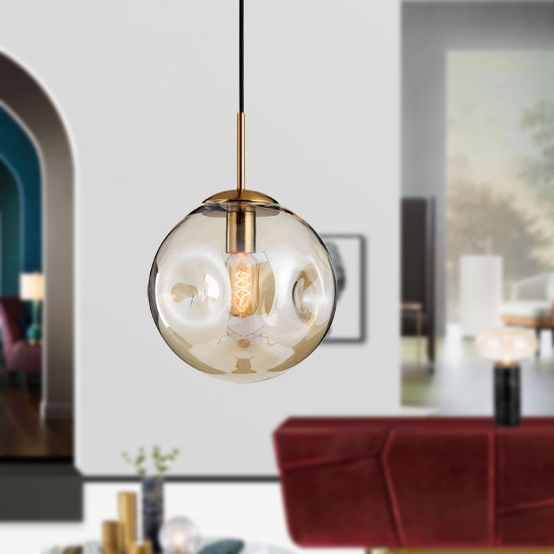 Globe Pendant Light Nordic Amber/Smoke Gray Dimpled Glass 1 Head Dining Room Hanging Ceiling Light Clearhalo 'Ceiling Lights' 'Modern Pendants' 'Modern' 'Pendant Lights' 'Pendants' Lighting' 289059