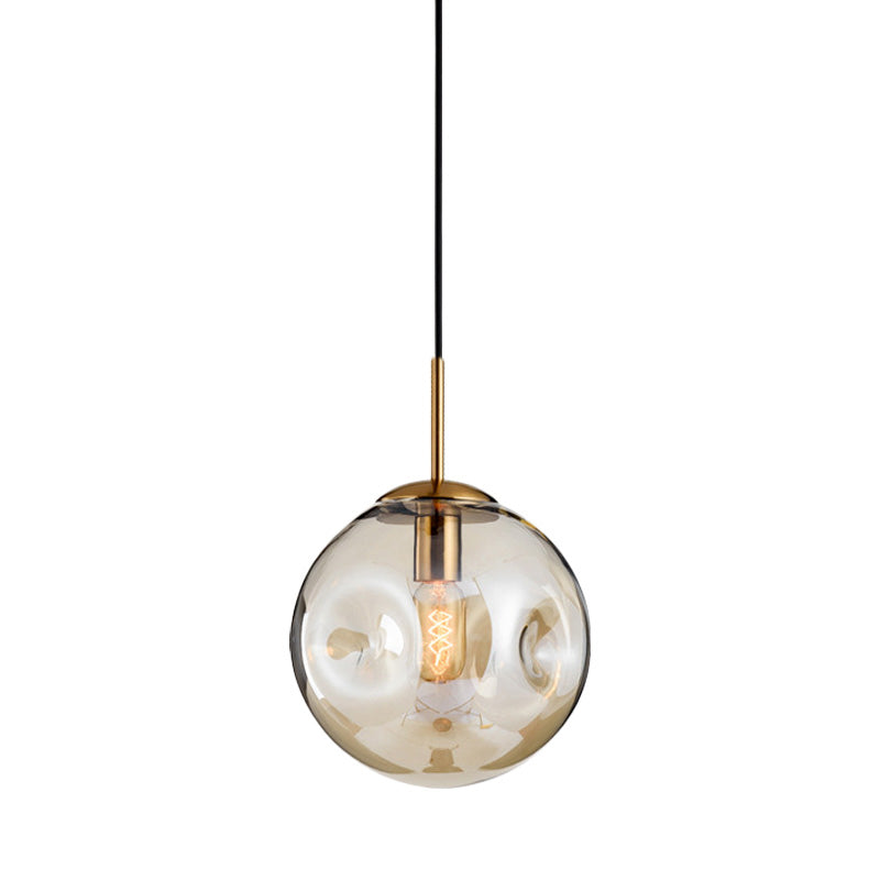 Globe Pendant Light Nordic Amber/Smoke Gray Dimpled Glass 1 Head Dining Room Hanging Ceiling Light Clearhalo 'Ceiling Lights' 'Modern Pendants' 'Modern' 'Pendant Lights' 'Pendants' Lighting' 289061