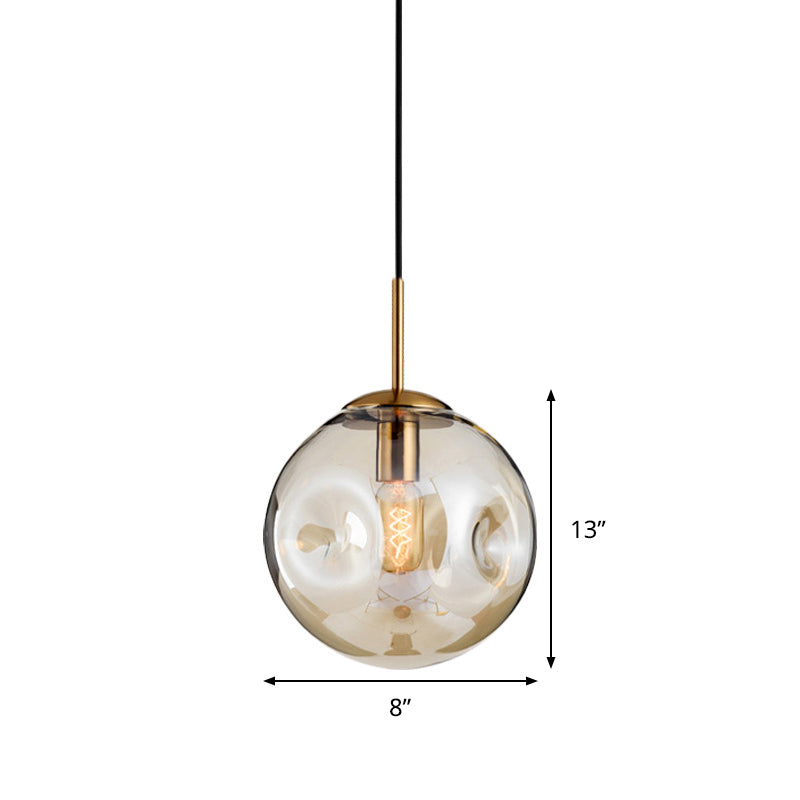 Globe Pendant Light Nordic Amber/Smoke Gray Dimpled Glass 1 Head Dining Room Hanging Ceiling Light Clearhalo 'Ceiling Lights' 'Modern Pendants' 'Modern' 'Pendant Lights' 'Pendants' Lighting' 289062