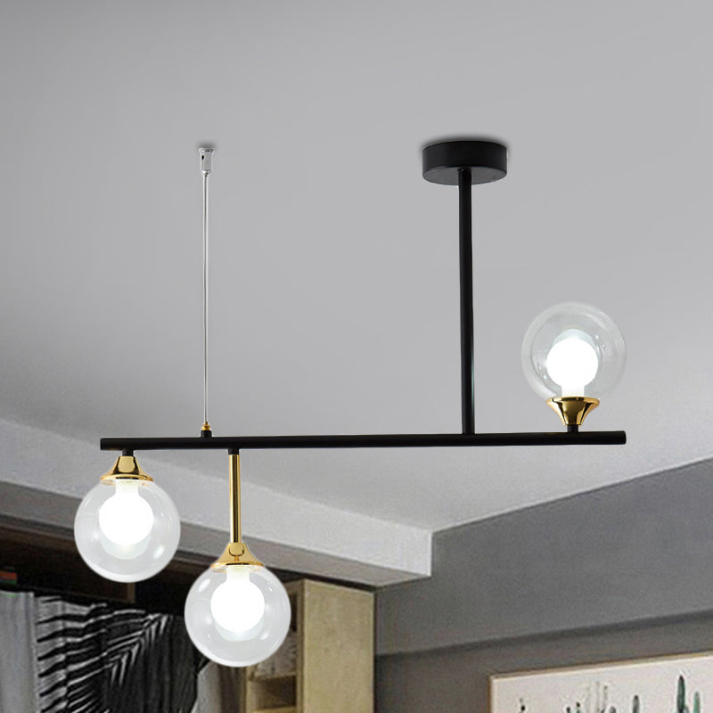 3 Bulbs Globe Island Lighting Modernism Clear Glass Pendant Light Fixture in Black for Dining Room Clearhalo 'Ceiling Lights' 'Close To Ceiling Lights' 'Glass shade' 'Glass' 'Island Lights' Lighting' 289212