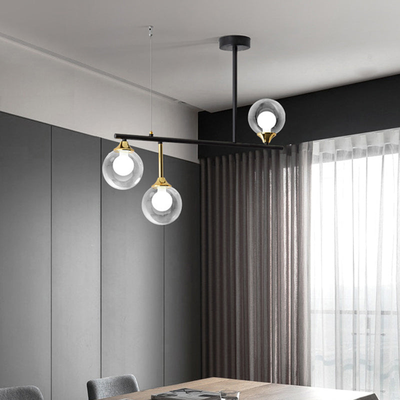 3 Bulbs Globe Island Lighting Modernism Clear Glass Pendant Light Fixture in Black for Dining Room Clearhalo 'Ceiling Lights' 'Close To Ceiling Lights' 'Glass shade' 'Glass' 'Island Lights' Lighting' 289214