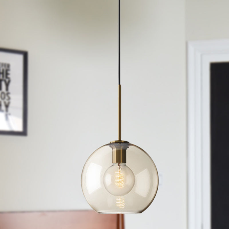 Amber Glass Sphere Pendant Lighting Modern 1 Head 8"/10"/12" Wide Brass Hanging Ceiling Light Brass 10" Clearhalo 'Ceiling Lights' 'Modern Pendants' 'Modern' 'Pendant Lights' 'Pendants' Lighting' 290029