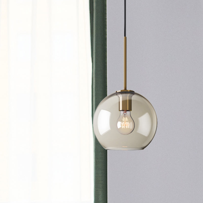 Amber Glass Sphere Pendant Lighting Modern 1 Head 8"/10"/12" Wide Brass Hanging Ceiling Light Clearhalo 'Ceiling Lights' 'Modern Pendants' 'Modern' 'Pendant Lights' 'Pendants' Lighting' 290036