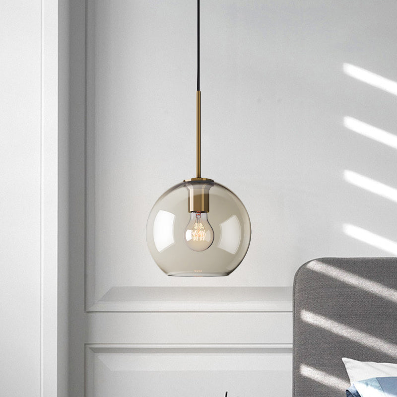 Amber Glass Sphere Pendant Lighting Modern 1 Head 8"/10"/12" Wide Brass Hanging Ceiling Light Clearhalo 'Ceiling Lights' 'Modern Pendants' 'Modern' 'Pendant Lights' 'Pendants' Lighting' 290037_0ed08b7b-4f45-4a4f-84bb-3fd995ad1190