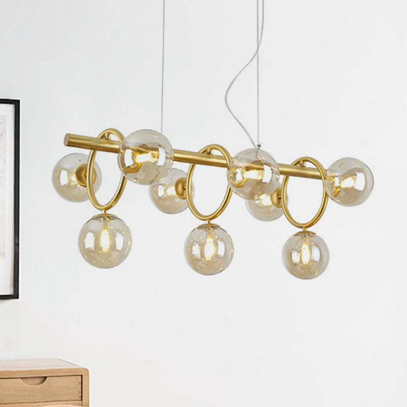 Gold Round Pendant Lighting Modern 9 Bulbs Cognac Glass LED Island Lamp with Linear Design Cognac Clearhalo 'Ceiling Lights' 'Chandeliers' 'Glass shade' 'Glass' 'Island Lights' Lighting' 303531