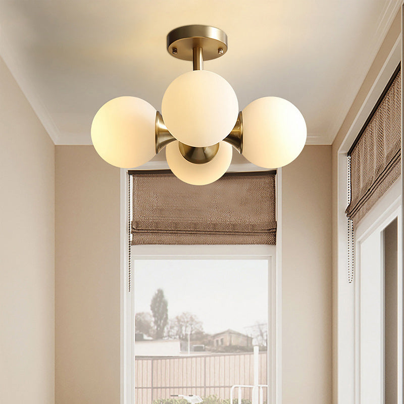 Gold Ball Semi Flush Light Contemporary 4 Heads Milky Glass Close to Ceiling Lamp Clearhalo 'Ceiling Lights' 'Chandeliers' 'Close To Ceiling Lights' 'Close to ceiling' 'Glass shade' 'Glass' 'Semi-flushmount' Lighting' 303705