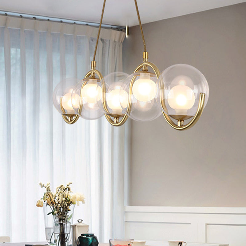 Minimalist Orb Shaped Clear Glass Island Lighting 3/5/7 Lights Hanging Light Fixture in Brass 5 Brass Clearhalo 'Ceiling Lights' 'Close To Ceiling Lights' 'Glass shade' 'Glass' 'Island Lights' Lighting' 311164