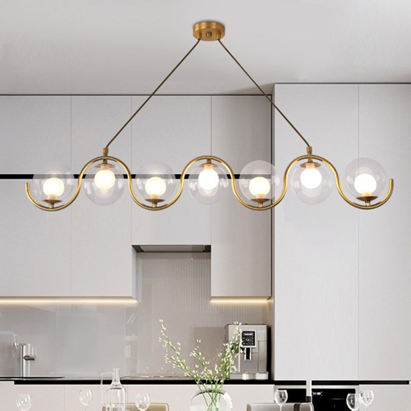 Minimalist Orb Shaped Clear Glass Island Lighting 3/5/7 Lights Hanging Light Fixture in Brass Clearhalo 'Ceiling Lights' 'Close To Ceiling Lights' 'Glass shade' 'Glass' 'Island Lights' Lighting' 311167