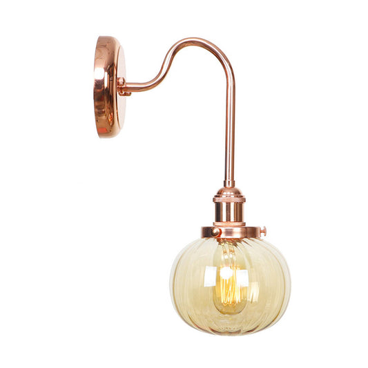 Vintage Globe Wall Lighting 1 Light Clear/Amber Glass Sconce in Copper with Curved Arm Clearhalo 'Art deco wall lights' 'Cast Iron' 'Glass' 'Industrial wall lights' 'Industrial' 'Middle century wall lights' 'Modern' 'Rustic wall lights' 'Tiffany' 'Traditional wall lights' 'Wall Lamps & Sconces' 'Wall Lights' Lighting' 315400