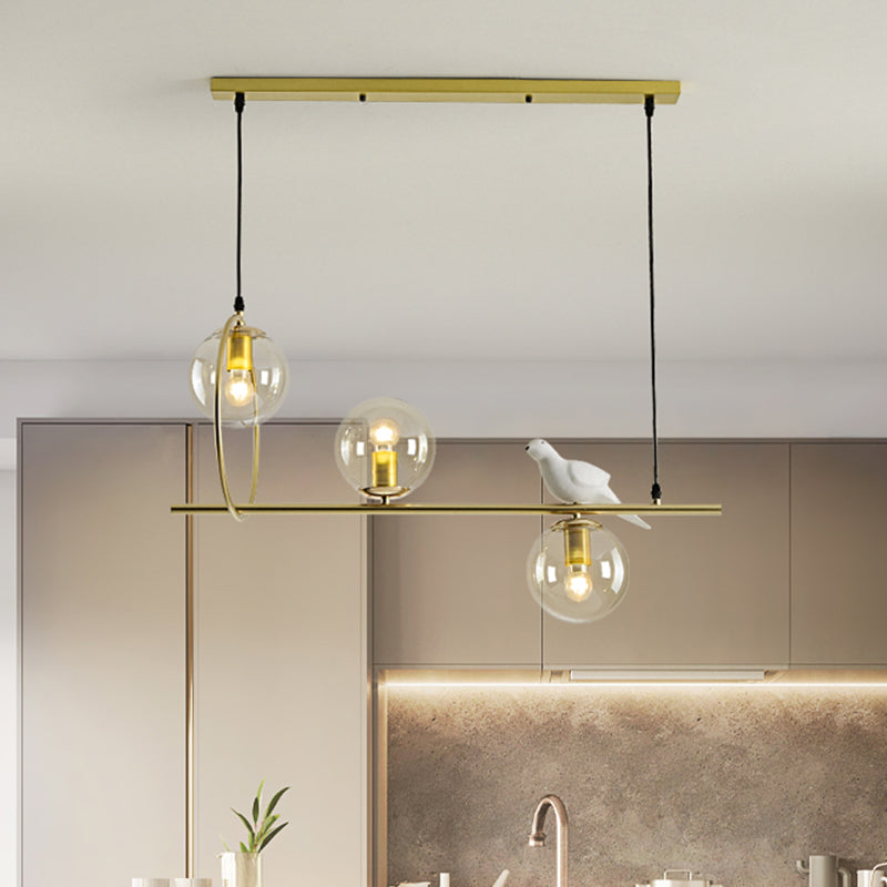 Global Island Lamp Modernist Clear Glass 3 Heads Gold Pendant Light Fixture with White Bird Clearhalo 'Ceiling Lights' 'Glass shade' 'Glass' 'Island Lights' Lighting' 316472