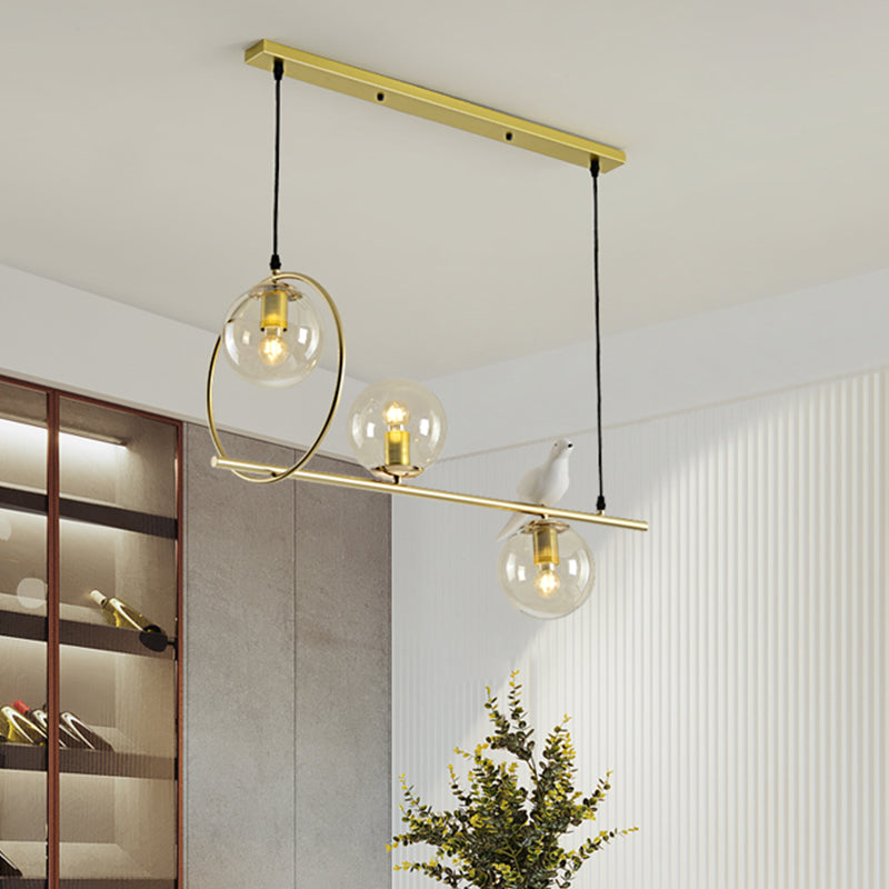 Global Island Lamp Modernist Clear Glass 3 Heads Gold Pendant Light Fixture with White Bird Clearhalo 'Ceiling Lights' 'Glass shade' 'Glass' 'Island Lights' Lighting' 316473