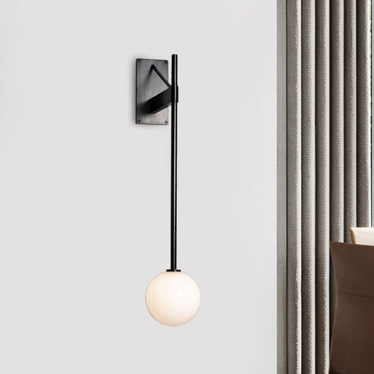 Round Sconce Modern Milk Glass 1 Bulb Black Wall Mount Light Fixture with Metal Pencil Arm Clearhalo 'Cast Iron' 'Glass' 'Industrial' 'Modern wall lights' 'Modern' 'Tiffany' 'Traditional wall lights' 'Wall Lamps & Sconces' 'Wall Lights' Lighting' 323671