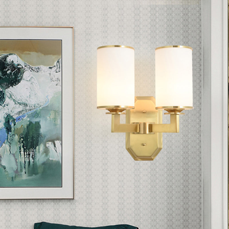 2 Heads Armed Sconce Modern Metal Wall Mount Light Fixture in Gold with Tube Opal Glass Shade Gold Clearhalo 'Cast Iron' 'Glass' 'Industrial' 'Modern wall lights' 'Modern' 'Tiffany' 'Traditional wall lights' 'Wall Lamps & Sconces' 'Wall Lights' Lighting' 324030