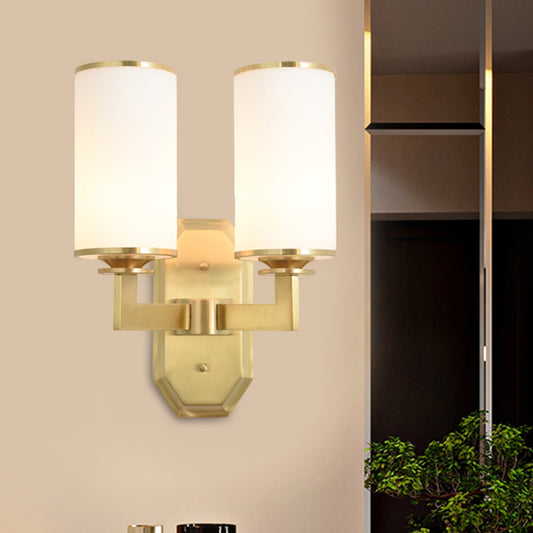 2 Heads Armed Sconce Modern Metal Wall Mount Light Fixture in Gold with Tube Opal Glass Shade Clearhalo 'Cast Iron' 'Glass' 'Industrial' 'Modern wall lights' 'Modern' 'Tiffany' 'Traditional wall lights' 'Wall Lamps & Sconces' 'Wall Lights' Lighting' 324031