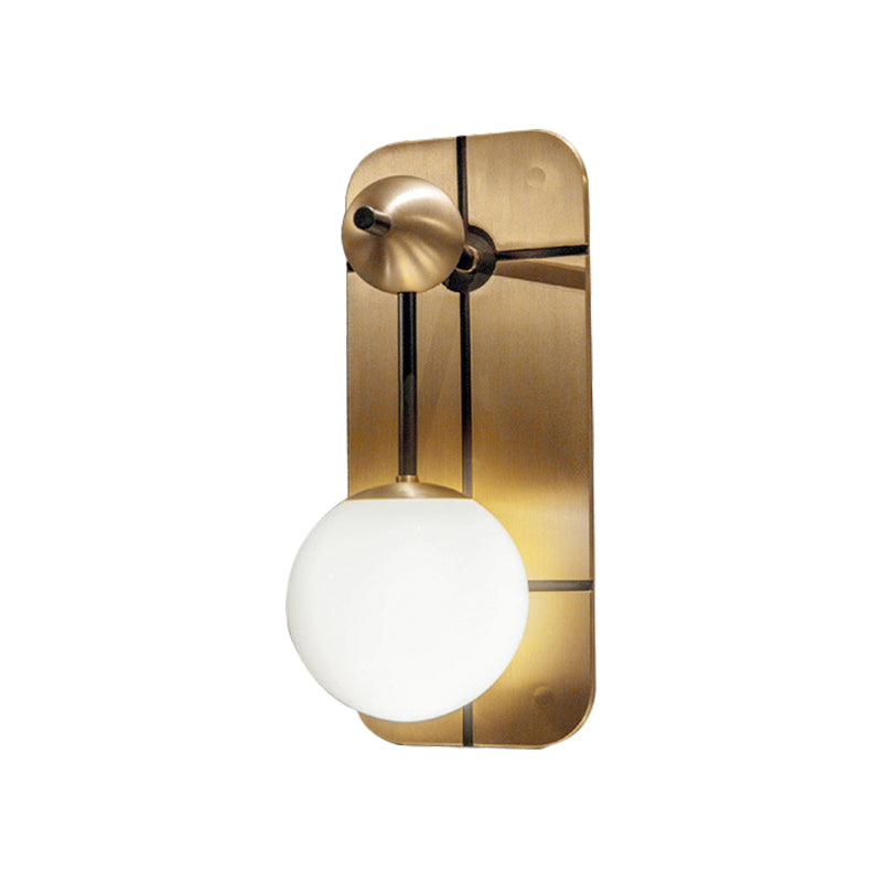 Opal Glass Ball Sconce Modernist 1 Head Brass Wall Mounted Light Fixture with Metal Rectangle Backplate Clearhalo 'Cast Iron' 'Glass' 'Industrial' 'Modern wall lights' 'Modern' 'Tiffany' 'Traditional wall lights' 'Wall Lamps & Sconces' 'Wall Lights' Lighting' 324118