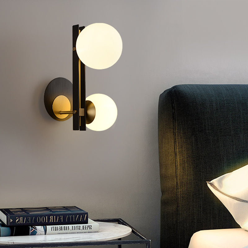 2 Bulbs Sphere Sconce Light Contemporary Milky Glass Wall Mounted Lighting in Black and Gold Black-Gold Clearhalo 'Cast Iron' 'Glass' 'Industrial' 'Modern wall lights' 'Modern' 'Tiffany' 'Traditional wall lights' 'Wall Lamps & Sconces' 'Wall Lights' Lighting' 324120