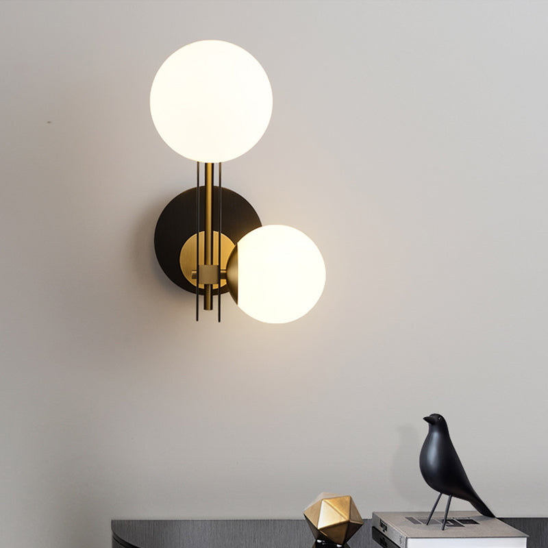 2 Bulbs Sphere Sconce Light Contemporary Milky Glass Wall Mounted Lighting in Black and Gold Clearhalo 'Cast Iron' 'Glass' 'Industrial' 'Modern wall lights' 'Modern' 'Tiffany' 'Traditional wall lights' 'Wall Lamps & Sconces' 'Wall Lights' Lighting' 324121