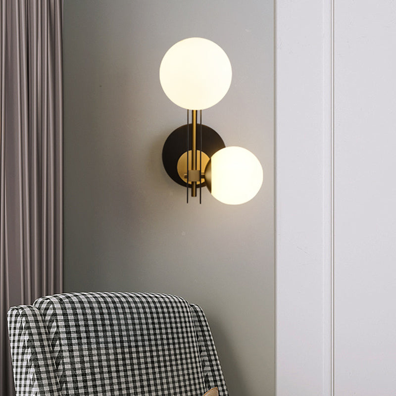 2 Bulbs Sphere Sconce Light Contemporary Milky Glass Wall Mounted Lighting in Black and Gold Clearhalo 'Cast Iron' 'Glass' 'Industrial' 'Modern wall lights' 'Modern' 'Tiffany' 'Traditional wall lights' 'Wall Lamps & Sconces' 'Wall Lights' Lighting' 324122