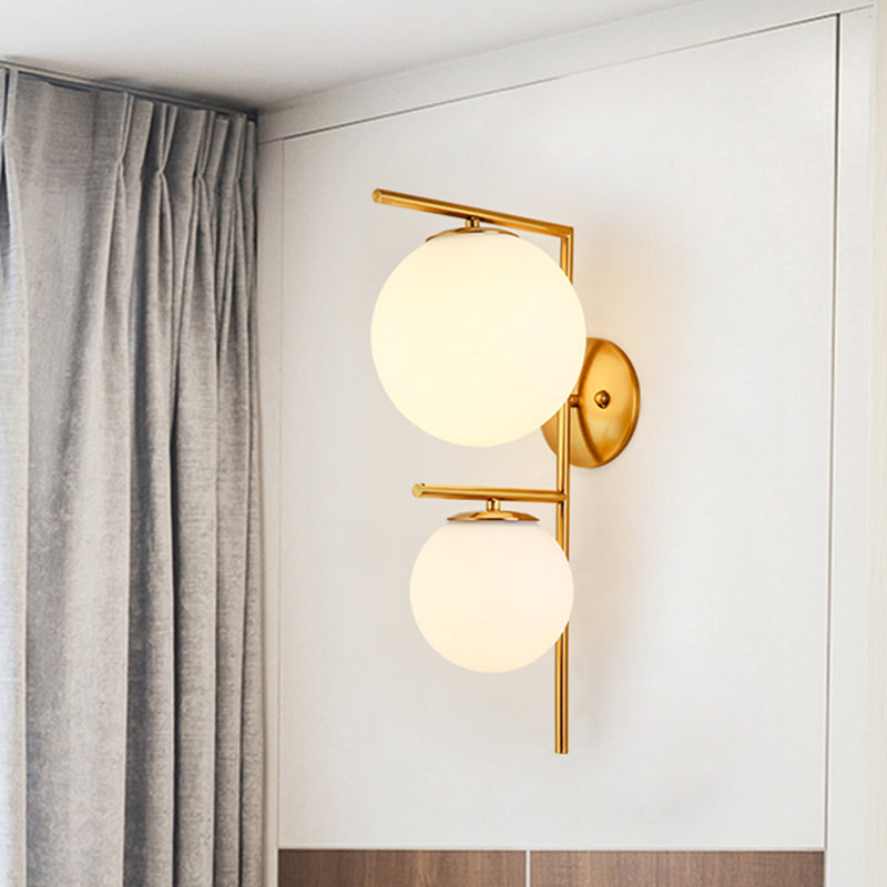 White Glass Spherical Sconce Contemporary 2 Heads Wall Mounted Light Fixture in Gold Clearhalo 'Cast Iron' 'Glass' 'Industrial' 'Modern wall lights' 'Modern' 'Tiffany' 'Traditional wall lights' 'Wall Lamps & Sconces' 'Wall Lights' Lighting' 324181