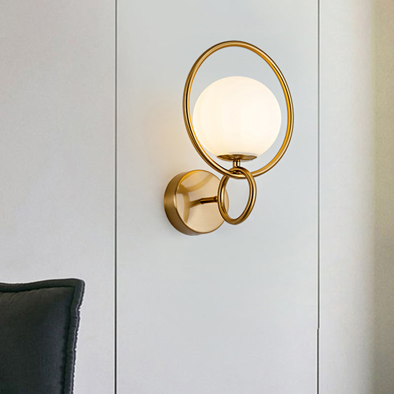 Metal Circle Sconce Light Modernist 1 Head Gold Wall Mounted Lamp with Orb White Glass Shade Clearhalo 'Cast Iron' 'Glass' 'Industrial' 'Modern wall lights' 'Modern' 'Tiffany' 'Traditional wall lights' 'Wall Lamps & Sconces' 'Wall Lights' Lighting' 324251