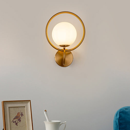 Metal Circle Sconce Light Modernist 1 Head Gold Wall Mounted Lamp with Orb White Glass Shade Clearhalo 'Cast Iron' 'Glass' 'Industrial' 'Modern wall lights' 'Modern' 'Tiffany' 'Traditional wall lights' 'Wall Lamps & Sconces' 'Wall Lights' Lighting' 324252