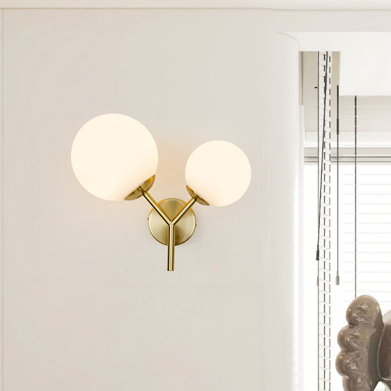 White Glass Spherical Sconce Contemporary 2 Heads Wall Mounted Light Fixture in Gold Clearhalo 'Cast Iron' 'Glass' 'Industrial' 'Modern wall lights' 'Modern' 'Tiffany' 'Traditional wall lights' 'Wall Lamps & Sconces' 'Wall Lights' Lighting' 324279