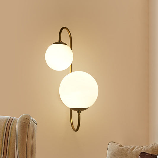 2 Bulbs Armed Sconce Contemporary Metal Wall Lighting Fixture in Gold with Ball Opal Glass Shade Gold Clearhalo 'Cast Iron' 'Glass' 'Industrial' 'Modern wall lights' 'Modern' 'Tiffany' 'Traditional wall lights' 'Wall Lamps & Sconces' 'Wall Lights' Lighting' 324303