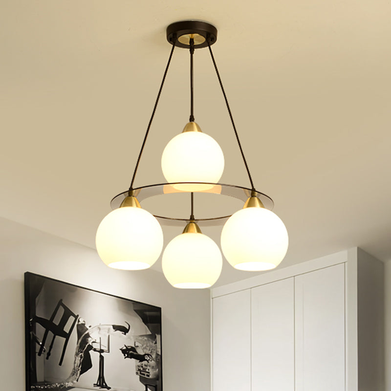 Modern 4 Heads Chandelier Light Black and Gold Spherical Ceiling Suspension Lamp with Opal Glass Shade Black-Gold Clearhalo 'Ceiling Lights' 'Chandeliers' 'Glass shade' 'Glass' 'Modern Chandeliers' 'Modern' Lighting' 324344