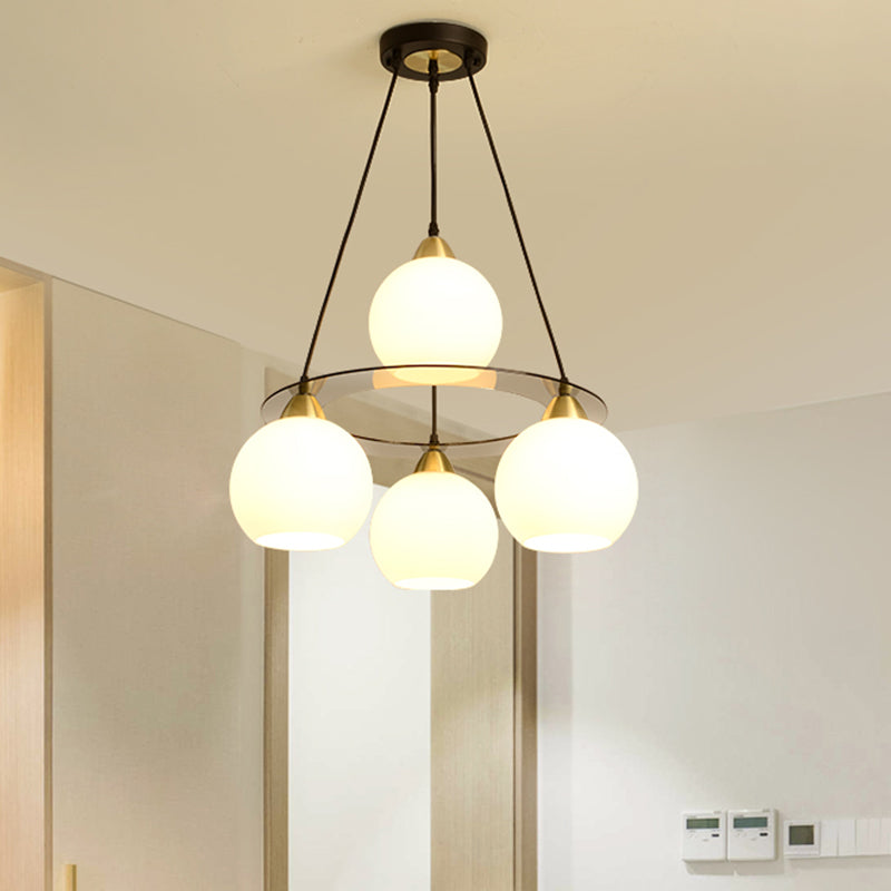 Modern 4 Heads Chandelier Light Black and Gold Spherical Ceiling Suspension Lamp with Opal Glass Shade Clearhalo 'Ceiling Lights' 'Chandeliers' 'Glass shade' 'Glass' 'Modern Chandeliers' 'Modern' Lighting' 324345