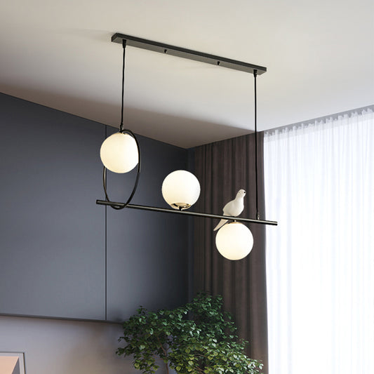 3 Heads Globe Island Lamp Modernist Milk Glass Pendant Lighting Fixture in Black with Bird Black Clearhalo 'Ceiling Lights' 'Chandeliers' 'Glass shade' 'Glass' 'Island Lights' Lighting' 324759