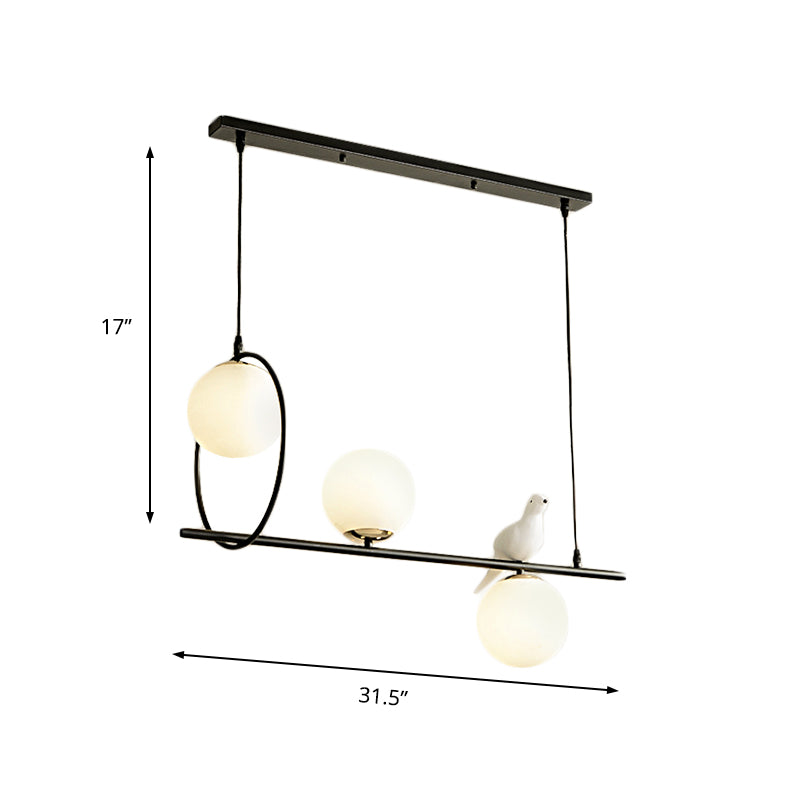 3 Heads Globe Island Lamp Modernist Milk Glass Pendant Lighting Fixture in Black with Bird Clearhalo 'Ceiling Lights' 'Chandeliers' 'Glass shade' 'Glass' 'Island Lights' Lighting' 324762