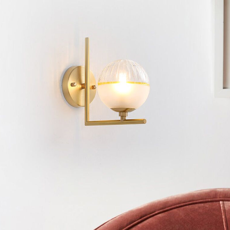 Frosted Glass Global Sconce Modernist 1 Head Brass Wall Mounted Light Fixture with Metal Arm Clearhalo 'Cast Iron' 'Glass' 'Industrial' 'Modern wall lights' 'Modern' 'Tiffany' 'Traditional wall lights' 'Wall Lamps & Sconces' 'Wall Lights' Lighting' 325813